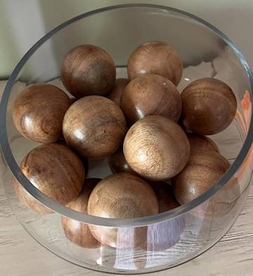 Acacia wooden balls on a bowl